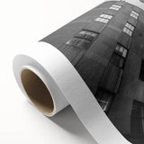 Art deco poster of New York City skyline in muted gray and blue tones on rolled canvas, ideal for nursery wall art.