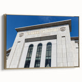 Framed canvas wall art featuring a vintage-style New York City landscape in black and gold tones, ideal for bedroom decor.