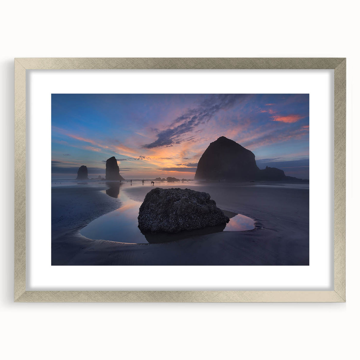 Textured art print of Cannon Beach, Oregon, featuring abstract sandy hues on a silver-framed mat, ideal for bedroom art.