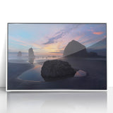 Acrylic print of Cannon Beach, Oregon, with soft pastel hues, framed in white, suitable for modern nursery decor.