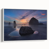 Vintage poster art of Cannon Beach, Oregon, in muted gray and blue tones on a framed canvas, ideal for living room decor.