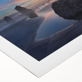 Art deco poster of Cannon Beach, Oregon, in muted earth tones on rolled canvas, suitable for dining room decor.