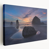 Large canvas print of Cannon Beach, Oregon with soft blue and gray tones, suitable for kitchen wall art.