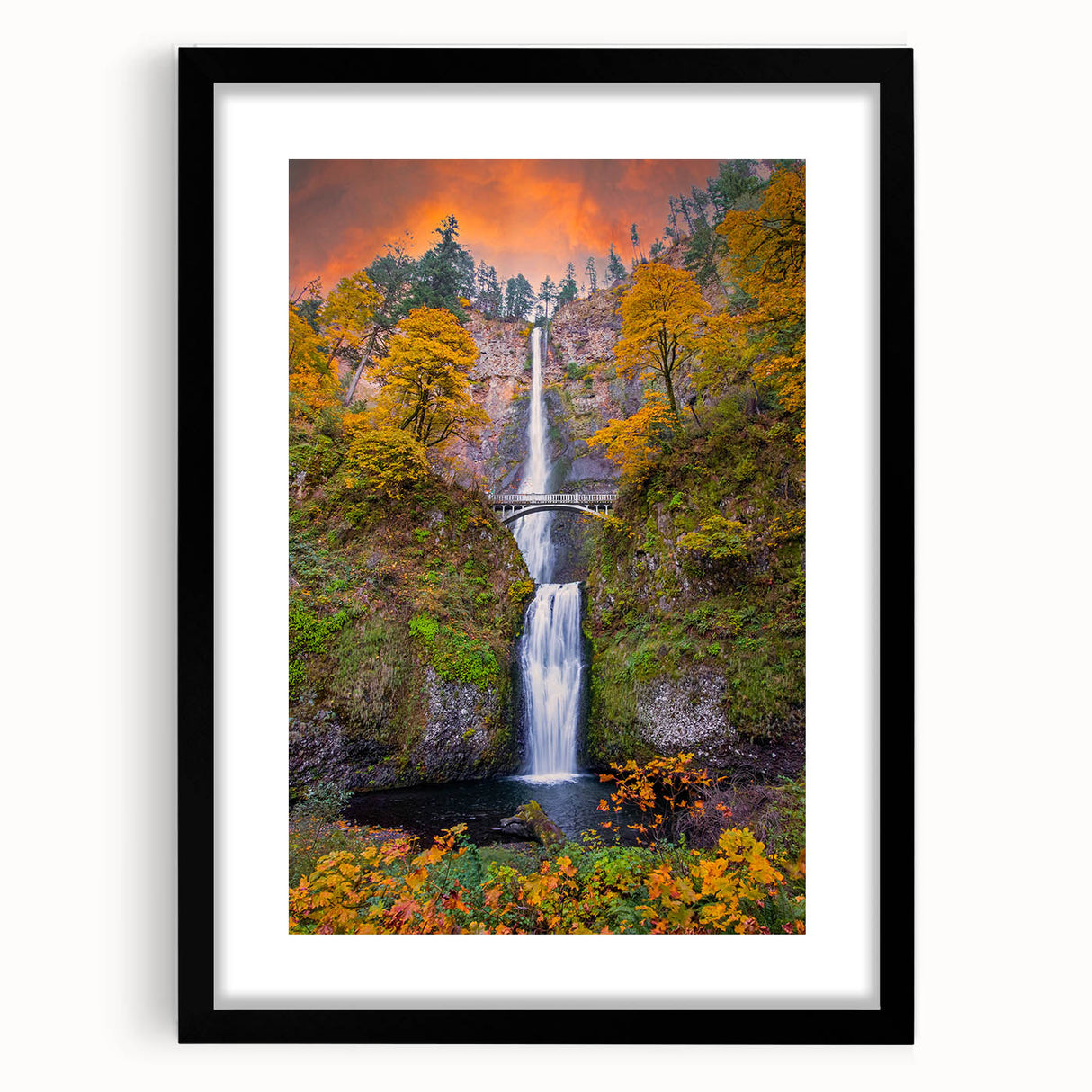 Extra large framed print of Multnomah Falls in vibrant green and blue tones, ideal for living room wall art.