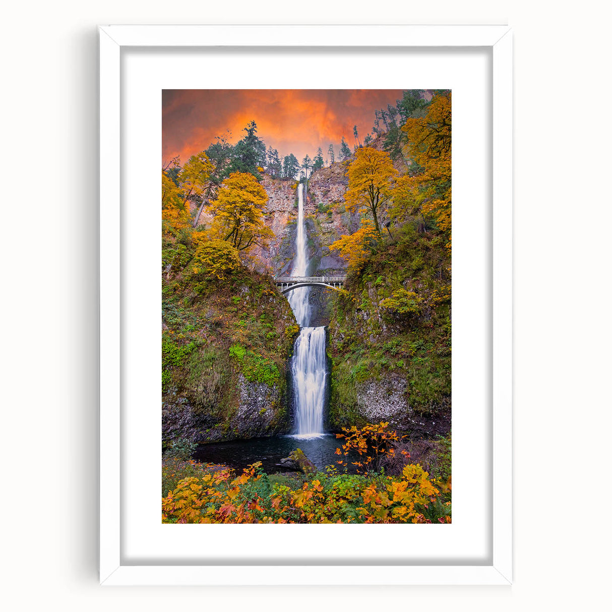 Abstract art print of Multnomah Falls in Oregon, using muted green and blue tones on a white framed canvas.