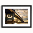 Colorful abstract art print of Philadelphia skyline in vibrant hues, framed in black, ideal for living room decor.