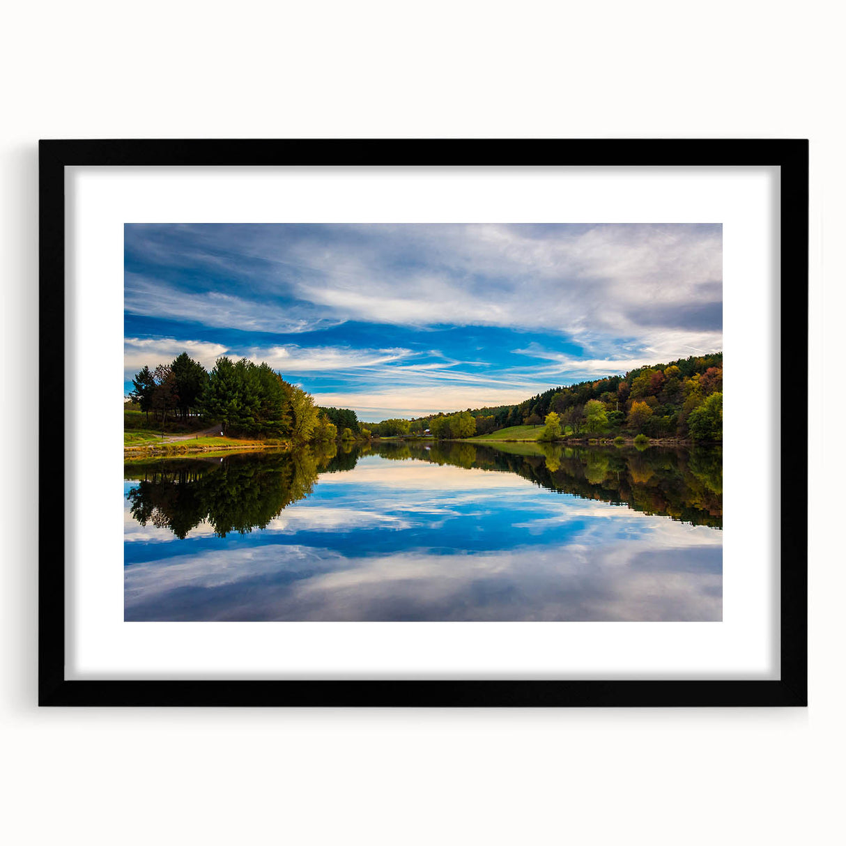 Abstract art print of a colorful, textured Pennsylvania scenery on a large canvas, framed in black.