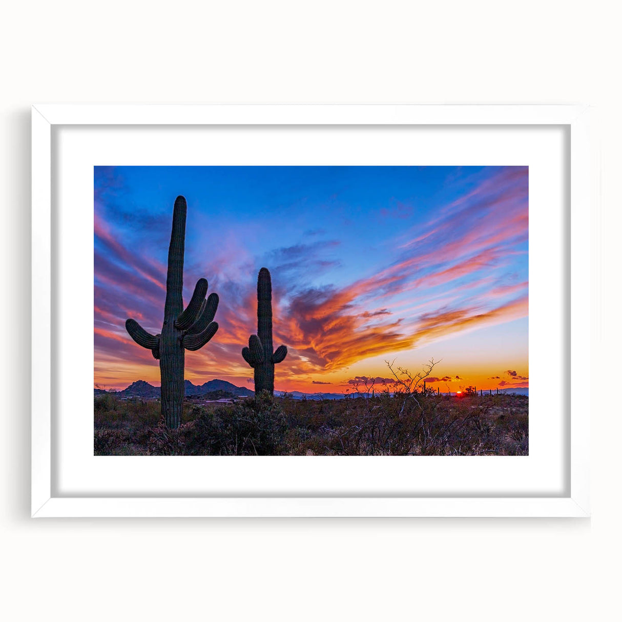 Abstract art print of Phoenix valley in muted orange and blue tones on a framed white mat.