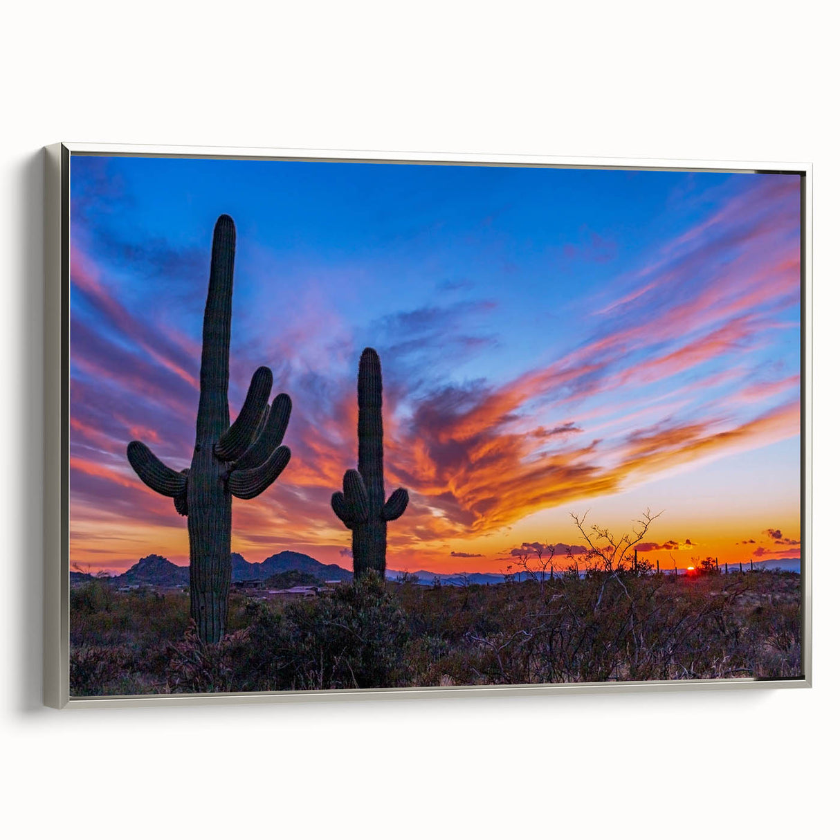 Framed canvas featuring a landscape art painting of Phoenix Valley in muted earth tones and silver frame.