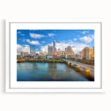 Abstract art print of Austin skyline in muted gray and blue tones on a framed white mat, ideal for dining room decor.