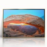 Framed acrylic print featuring a natural arch in Arches National Park, Utah, with warm earth tones.