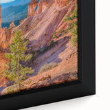 Close-up of a textured black wall art depicting Bryce Canyon in vibrant colors on a framed canvas.