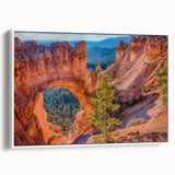 Vintage poster art of Bryce Canyon on framed canvas, featuring vibrant red and orange tones, ideal for living room decor.