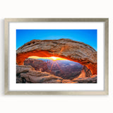 Textured art depicting abstract Canyonlands scenery in earthy tones on a silver-framed mat, suitable for bedroom decor.