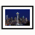 Extra large abstract art print of Seattle skyline in vibrant colors on textured canvas, framed in black.