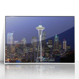 Acrylic print of Seattle skyline in muted gray and blue tones, framed in white, ideal for modern art wall decor.