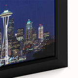 Framed canvas featuring a textured depiction of the Seattle skyline in black with colorful accents.
