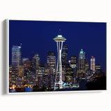 Framed canvas of vintage poster art featuring the Seattle skyline in black with colorful accents.