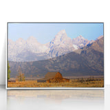 Acrylic print of the Grand Tetons with a white frame, featuring soft blue and green tones.