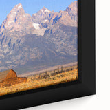 Extra large framed canvas of the Grand Tetons with a textured black foreground and colorful sky, ideal for living room decor.