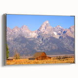 Framed canvas featuring a landscape art painting of the Grand Tetons in Wyoming with vibrant green and blue hues.