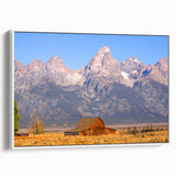 Vintage poster art of Grand Tetons landscape on framed canvas, featuring muted earth tones, ideal for living room decor.