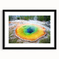 Colorful abstract art print of Yellowstone scenery on a textured, extra large canvas, framed in black.