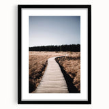 Extra large abstract art print of colorful, textured fall foliage, framed in black, ideal for living room decor.