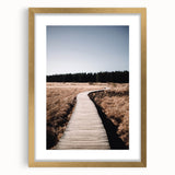 Abstract art print depicting textured fall scenery in warm orange and red hues on a large framed canvas.