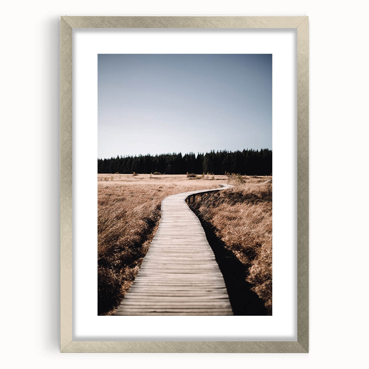 Textured art depicting abstract fall scenery in earthy tones on a framed silver mat, ideal for bedroom wall decor.