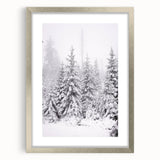 Textured art print of abstract winter scene in muted blue and white tones, framed in silver, ideal for bedroom wall decor.