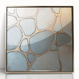 Framed acrylic artwork showcasing an abstract geometric design in gold, set against a crisp white background, perfect for modern home decor.