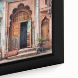 Close-up of a black framed canvas featuring a colorful, textured depiction of an ornate Indian door.