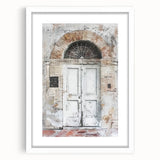 Abstract art print of a rustic Italian door in muted earth tones, framed with a white mat, suitable for dining room decor.