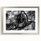 Textured abstract art print in neutral shades, framed in silver, ideal for modern bedroom decor.
