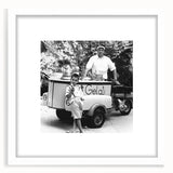 Abstract art print featuring stylized food and people in muted earth tones, framed in white, suitable for dining room decor.