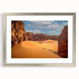 Abstract art print of Algerian scenery in muted earth tones on a silver-framed canvas.