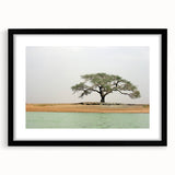 Extra large abstract art print featuring a colorful, textured depiction of a Mali scenery on a framed black mat.