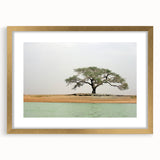 Textured abstract art print of a Mali scenery in muted earth tones, framed in gold, ideal for bedroom art.