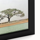 Close-up of black wall art featuring a textured, colorful African Mali scenery on extra large framed canvas.