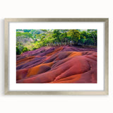 Abstract art print depicting a serene Mauritian landscape in soft blue and green tones, framed in silver.