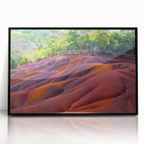 Large abstract wall art depicting a serene Mauritian landscape in muted earth tones, framed in black acrylic.