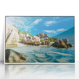 Acrylic print of Seychelles scenery in art deco style, with vivid blue and green tones, framed in white.