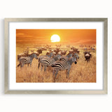 Abstract textured art print of an African landscape in earthy tones on a framed silver mat, suitable for bedroom decor.
