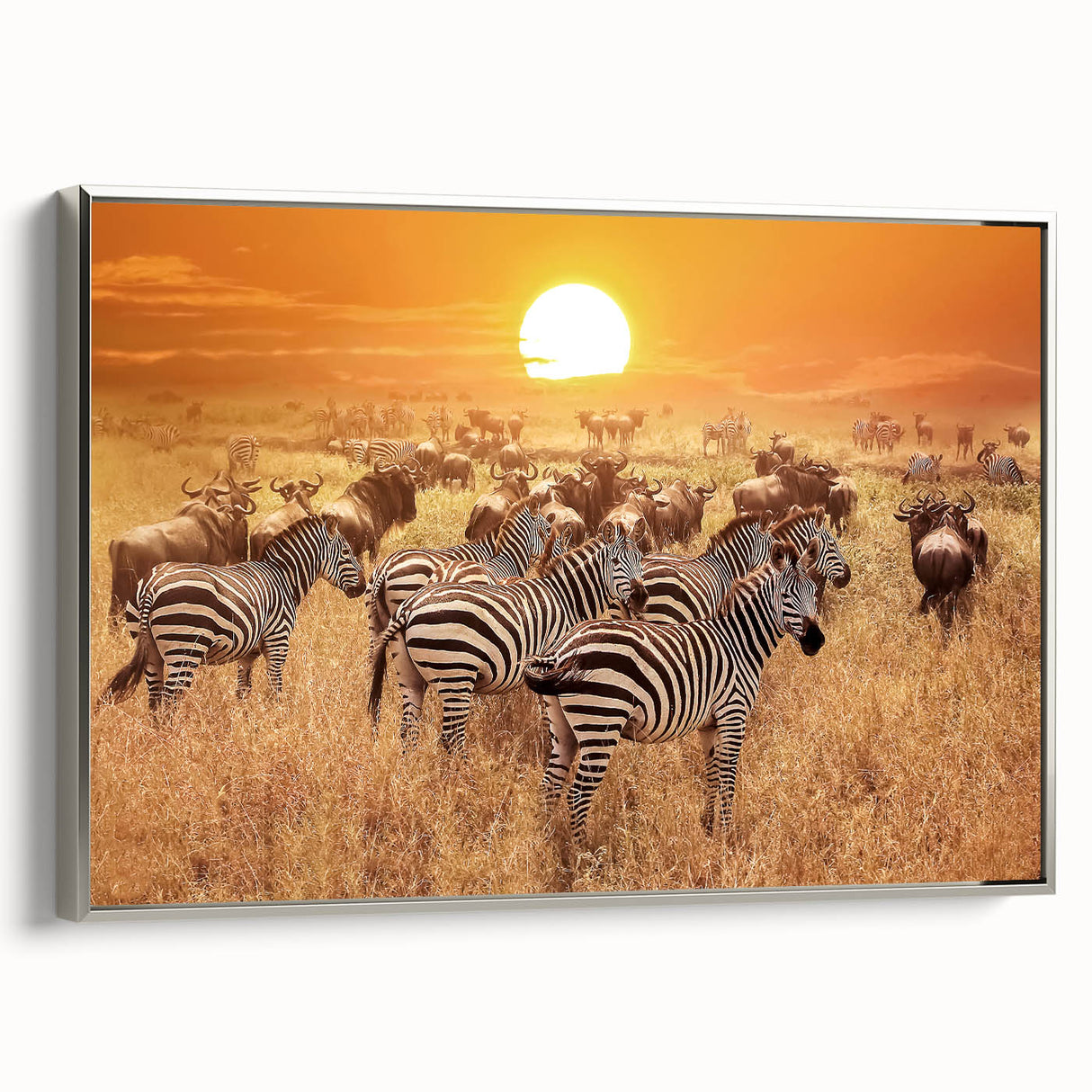 Framed canvas of a Tanzanian landscape with colorful skies and silhouetted acacia trees.
