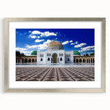 Textured abstract art print depicting a Tunisian landscape in earth tones, framed in silver, suitable for bedroom decor.