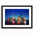 Extra large abstract art print of Shanghai skyline in vibrant colors on a textured canvas, framed in black.
