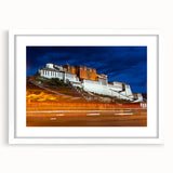 Abstract art print of a Tibetan landscape in muted blues and greens on a framed white canvas, ideal for dining room decor.