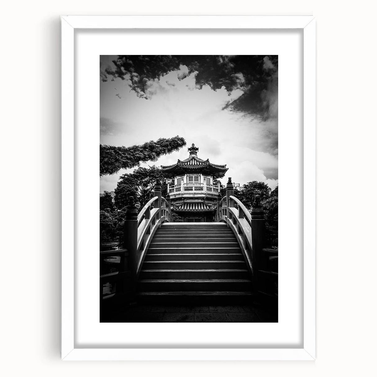 Abstract art print of Hong Kong skyline in muted gray and blue tones, framed with a white mat, ideal for dining room decor.