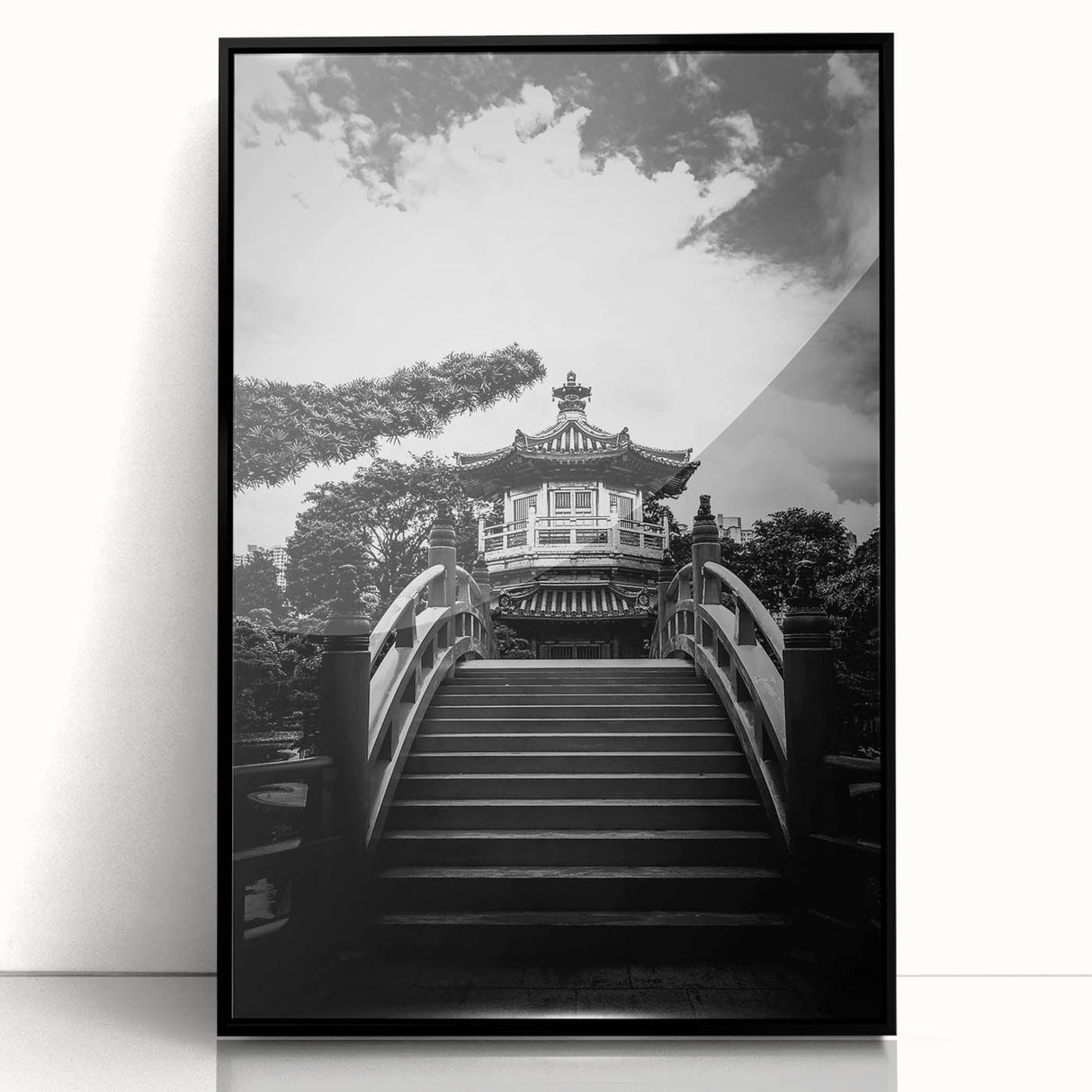 Large abstract wall art depicting the Hong Kong skyline in muted gray and blue tones, framed in black acrylic.